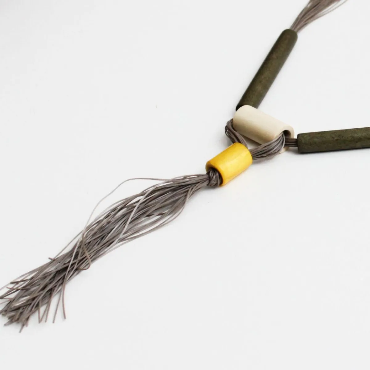 Greyish Green Elastic Tassel Necklace by Sylca